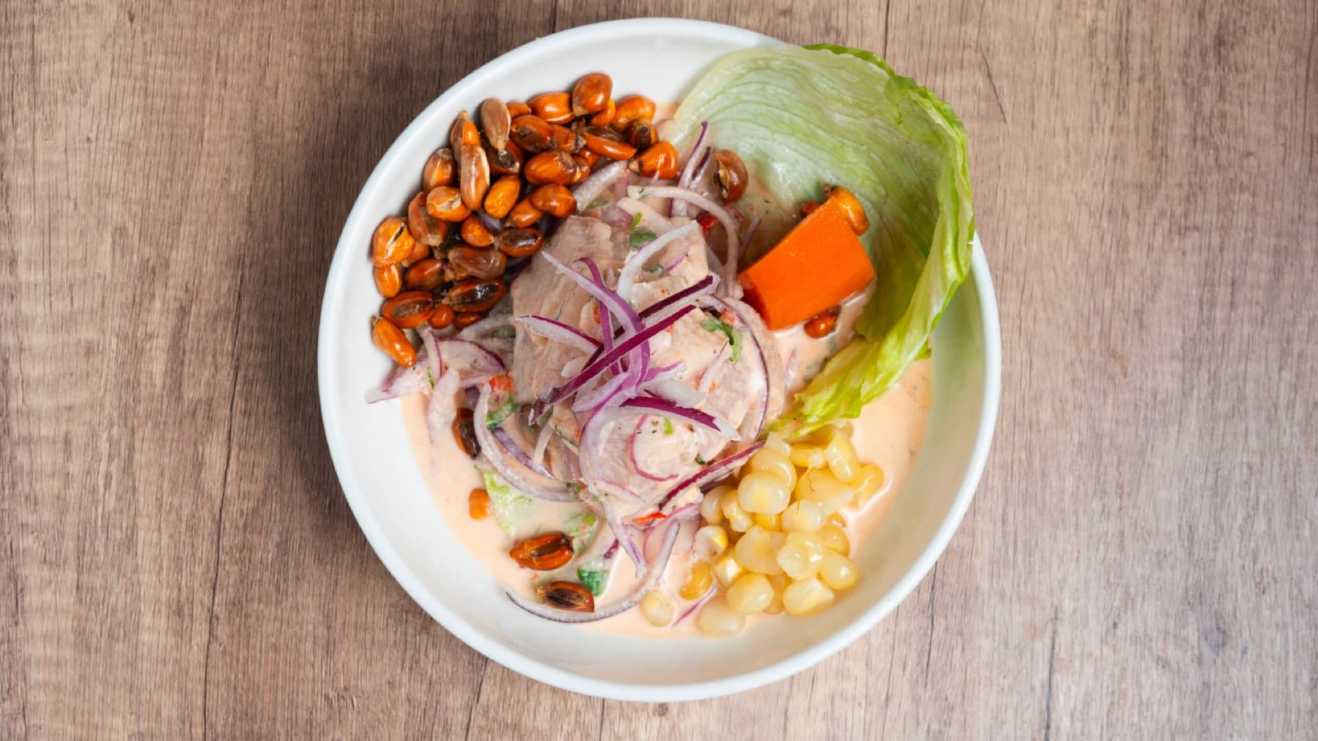 Ceviche de Pescado — fresh fish marinated in lime with Peruvian corn and sweet potato