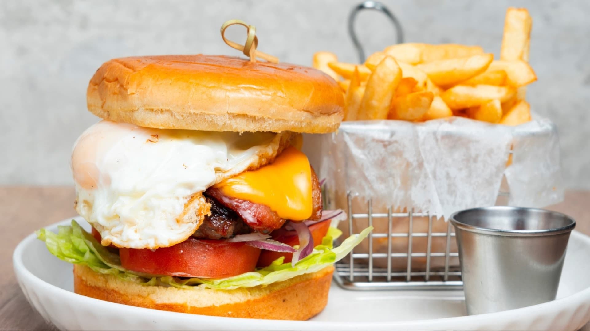 Royal Burger — Peruvian style burger with fried egg, cheese, and fries